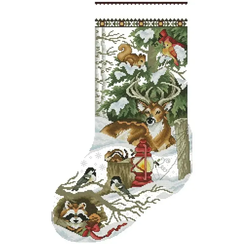 Forest Friends (DA099) Christmas stocking cross stitch design DA099: a resting deer with a raccoon, a chipmunk, chickadees and a cardinal gathered around a red lantern beneath a fir