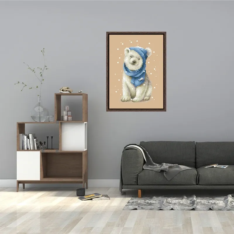 Framed White Bear design DPD271 hanging on a gray living-room wall above a dark couch and a bookshelf