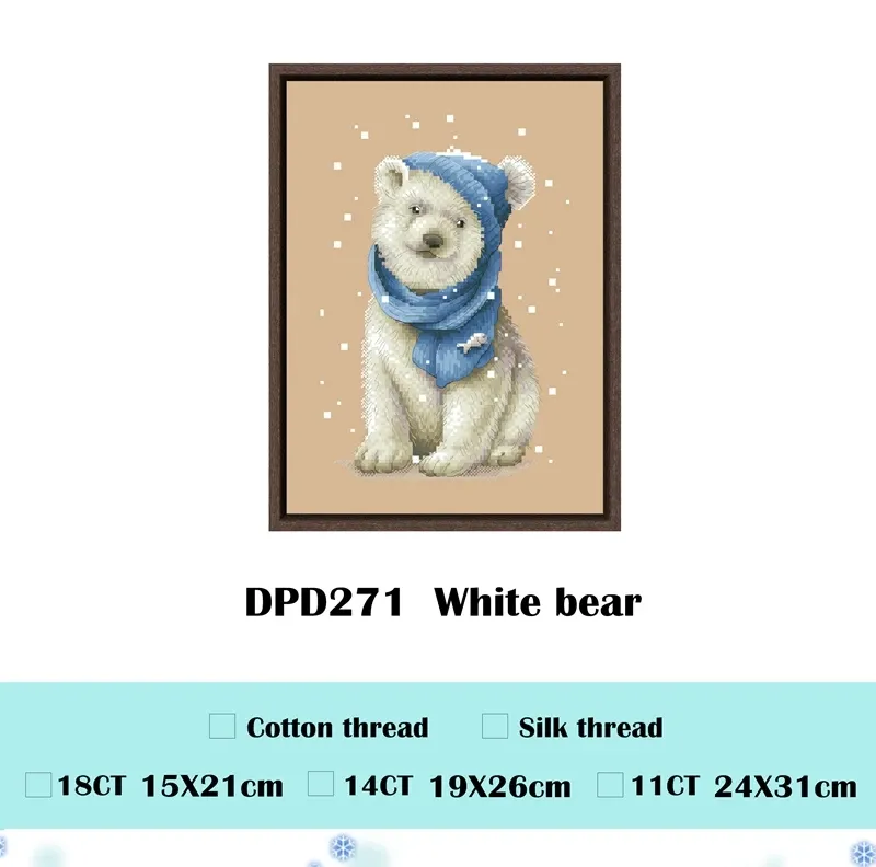 White Bear counted cross stitch design DPD271: a polar bear cub sitting in a denim-blue beanie and scarf decorated with a small fish