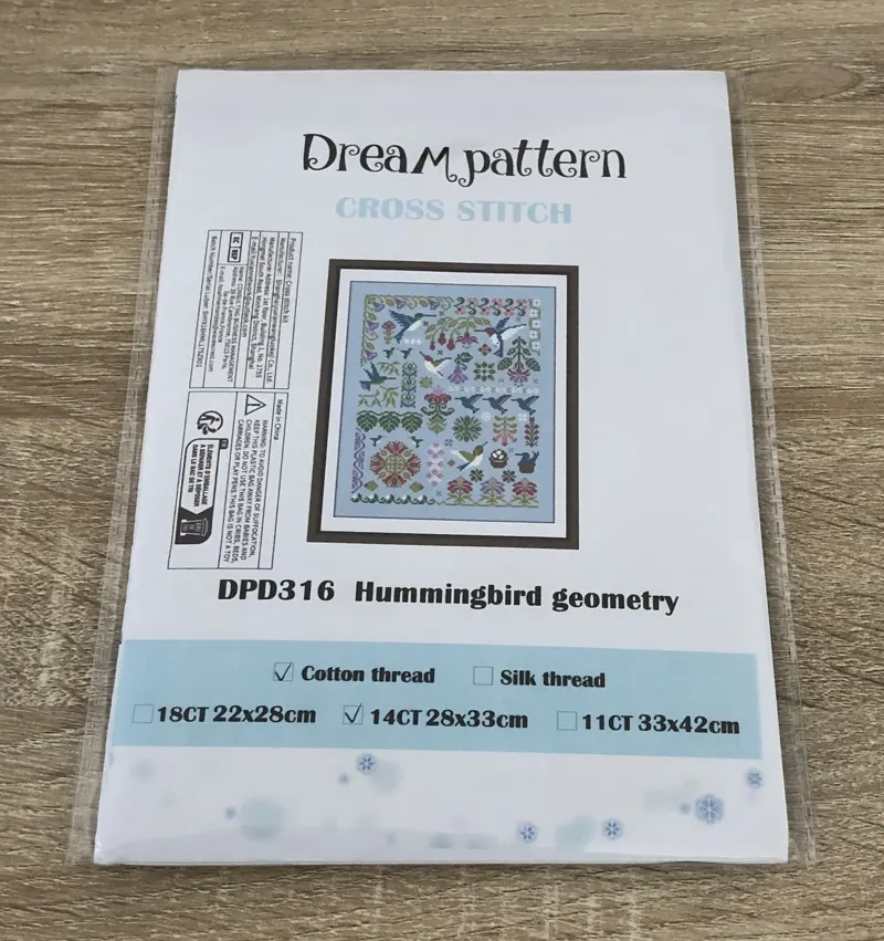 Buyer photo of the Hummingbird Geometry kit packet: the DPD316 design with hummingbirds and fuchsias on sky-blue fabric
