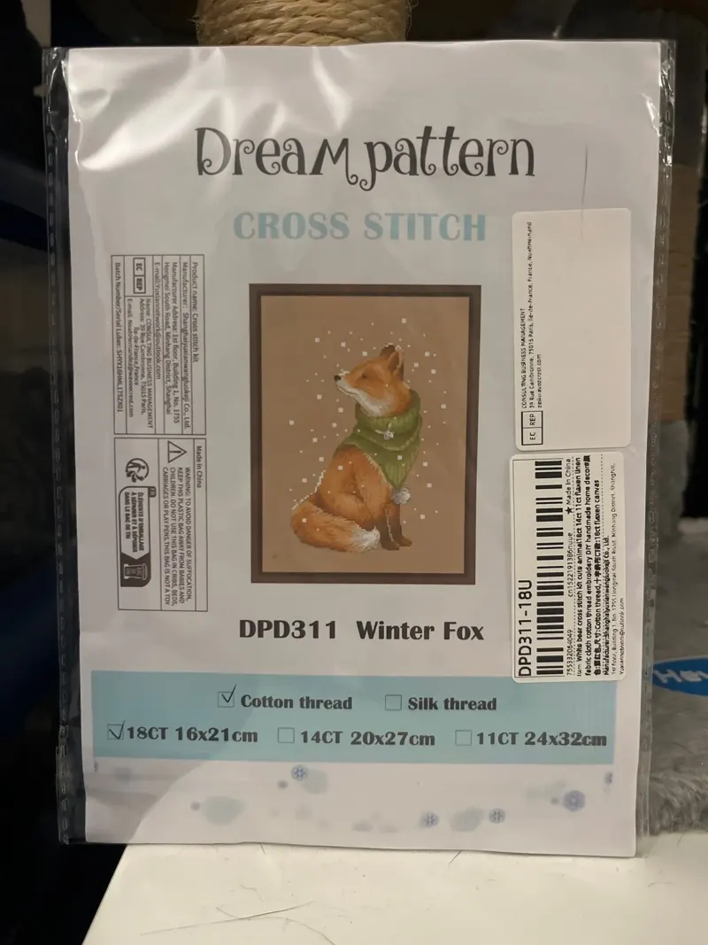 Buyer photo of the Winter Fox kit pouch: the DPD311 fox design in a green snood, with the 18CT box checked on the label